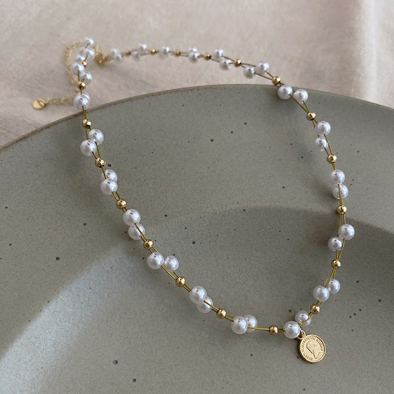 GOLD MEDAL PEARL NECKLACE