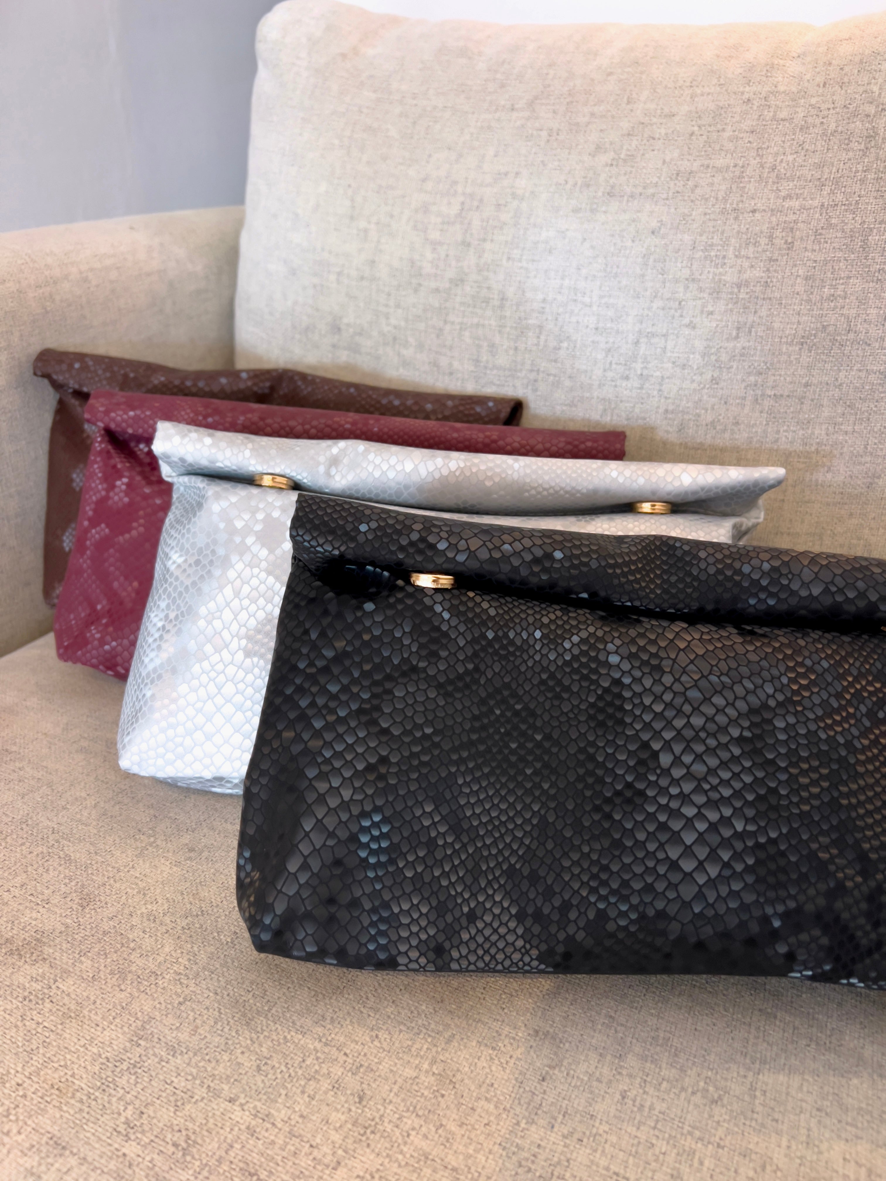 INDIRA SNAKE PRINT CLUTCH