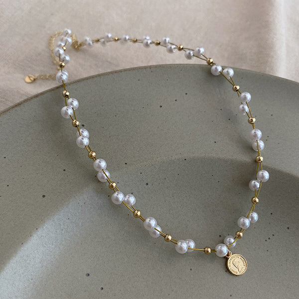 GOLD MEDAL PEARL NECKLACE